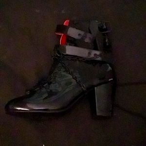 Black leather coffin buckles and chain heel boots